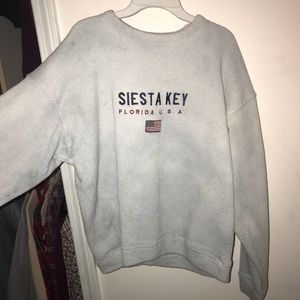White Siesta Key sweatshirt.